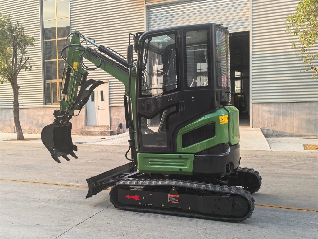 Green budget mini excavator with enclosed cab outside the Hongli factory
