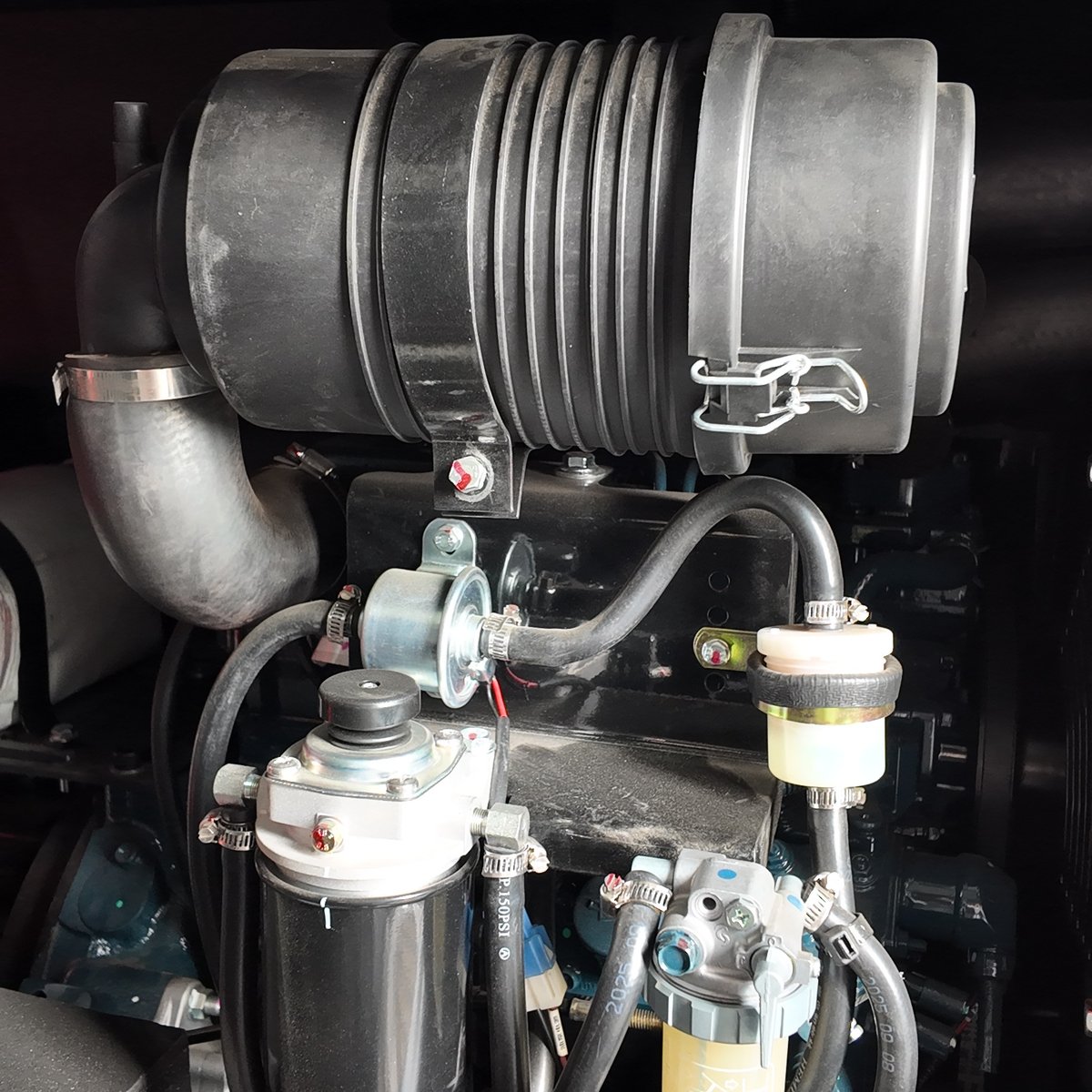 Air filter, fuel filter and water separator positioned for routine service access