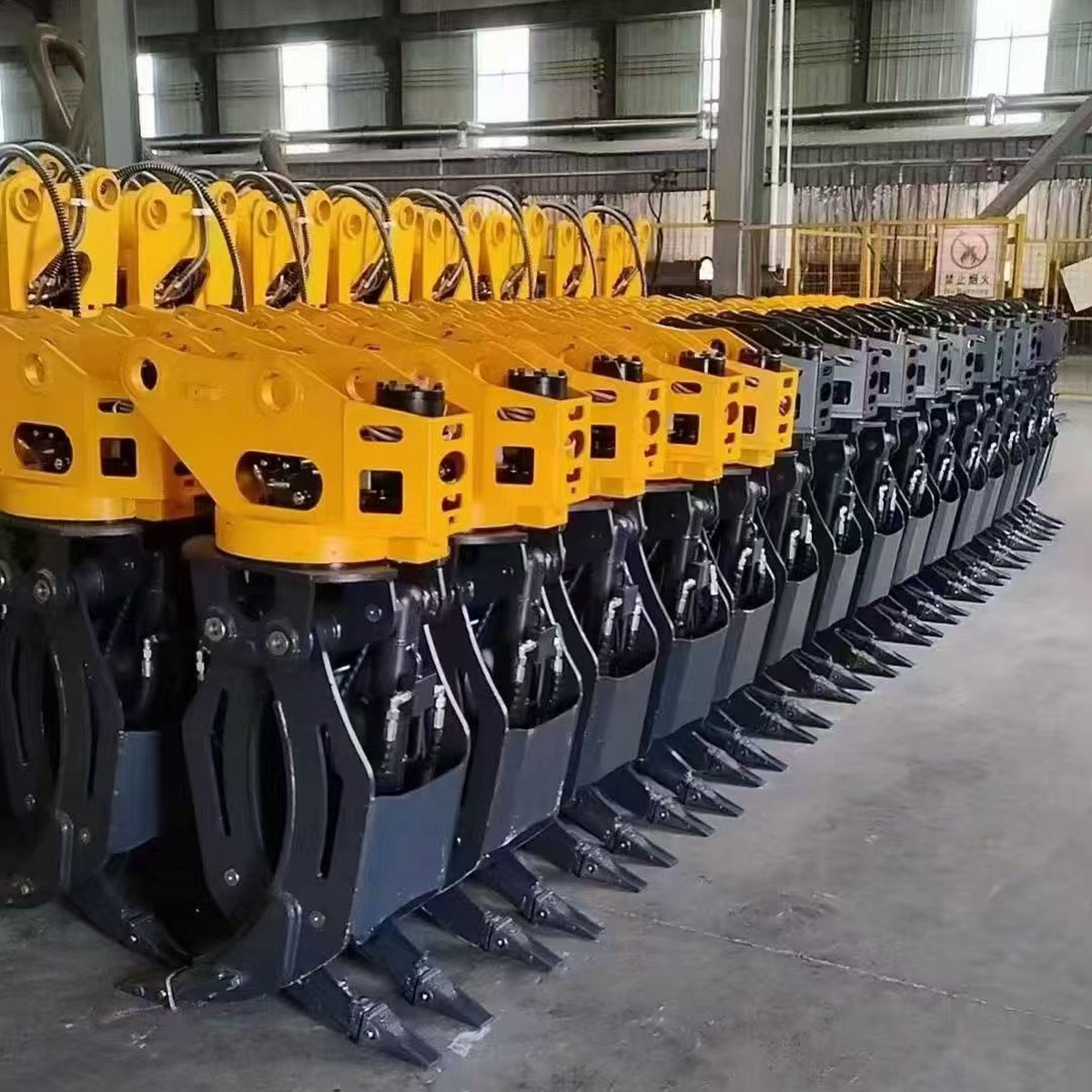 Hydraulic grapple attachments for mini excavators before shipment