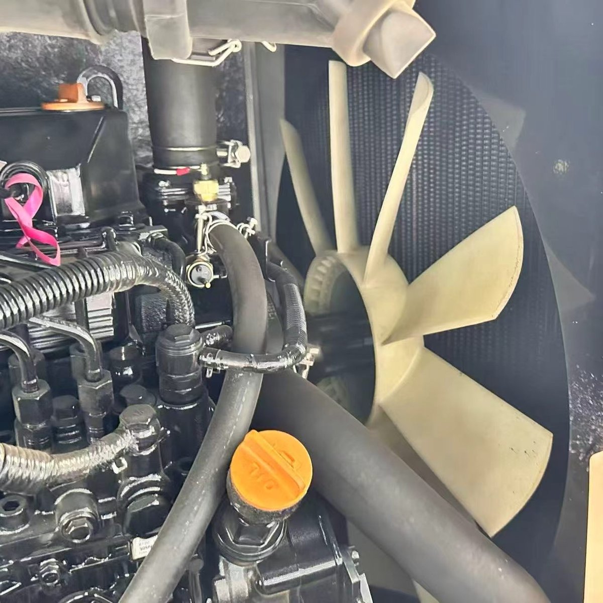 Engine cooling fan and radiator on a mini excavator