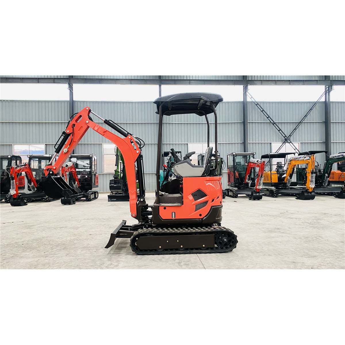 Orange HL18 mini excavator with an open canopy photographed in a workshop